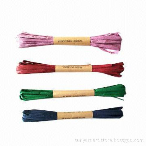 Paper raffia ribbon on plastic spool/paper string